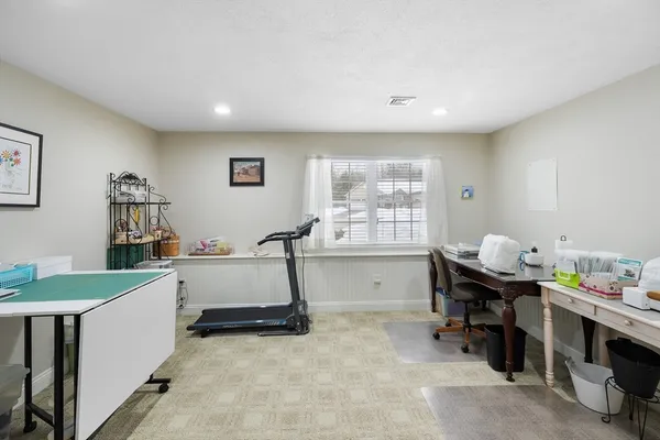 a room with furniture and musical instruments