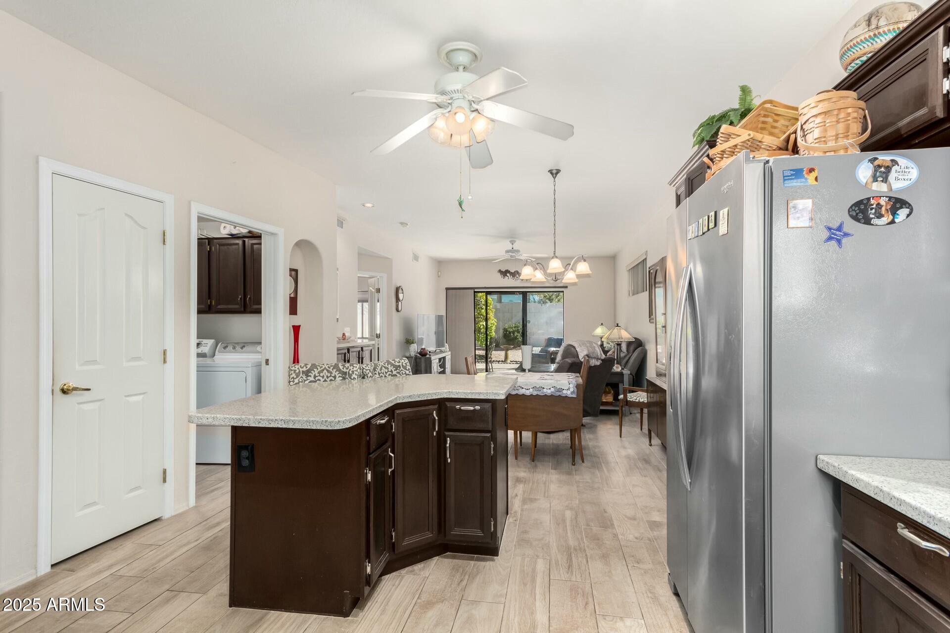 5445 East McKellips Road, Unit 54 Mesa, AZ 85215 - Photo 5 of 26 a very nice looking dining room with a large window and stainless steel appliances