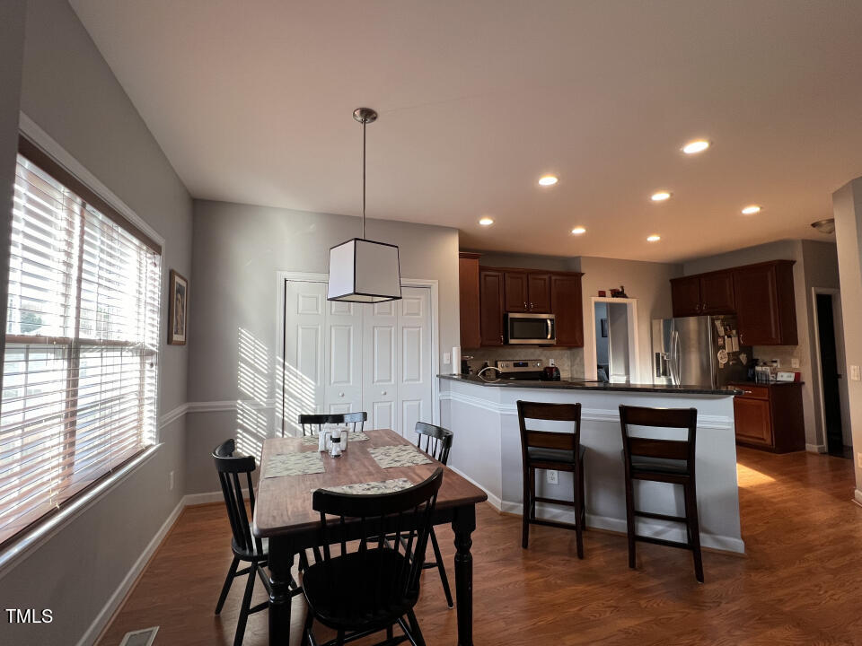 613 Seastone Street Raleigh, NC 27603 - Photo 13 of 13 a view of a dining room with furniture