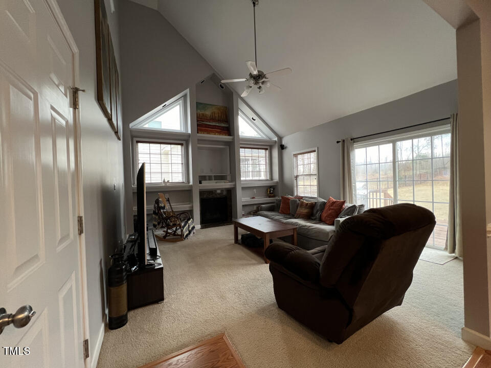 613 Seastone Street Raleigh, NC 27603 - Photo 4 of 13 a living room with furniture and a large window