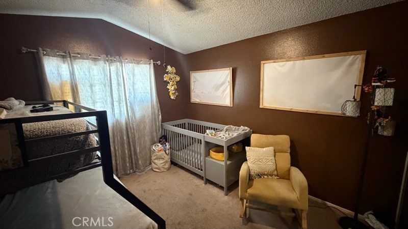 2478 KOA Drive Rialto, CA 92377 - Photo 8 of 18 a room with furniture and a flat screen tv
