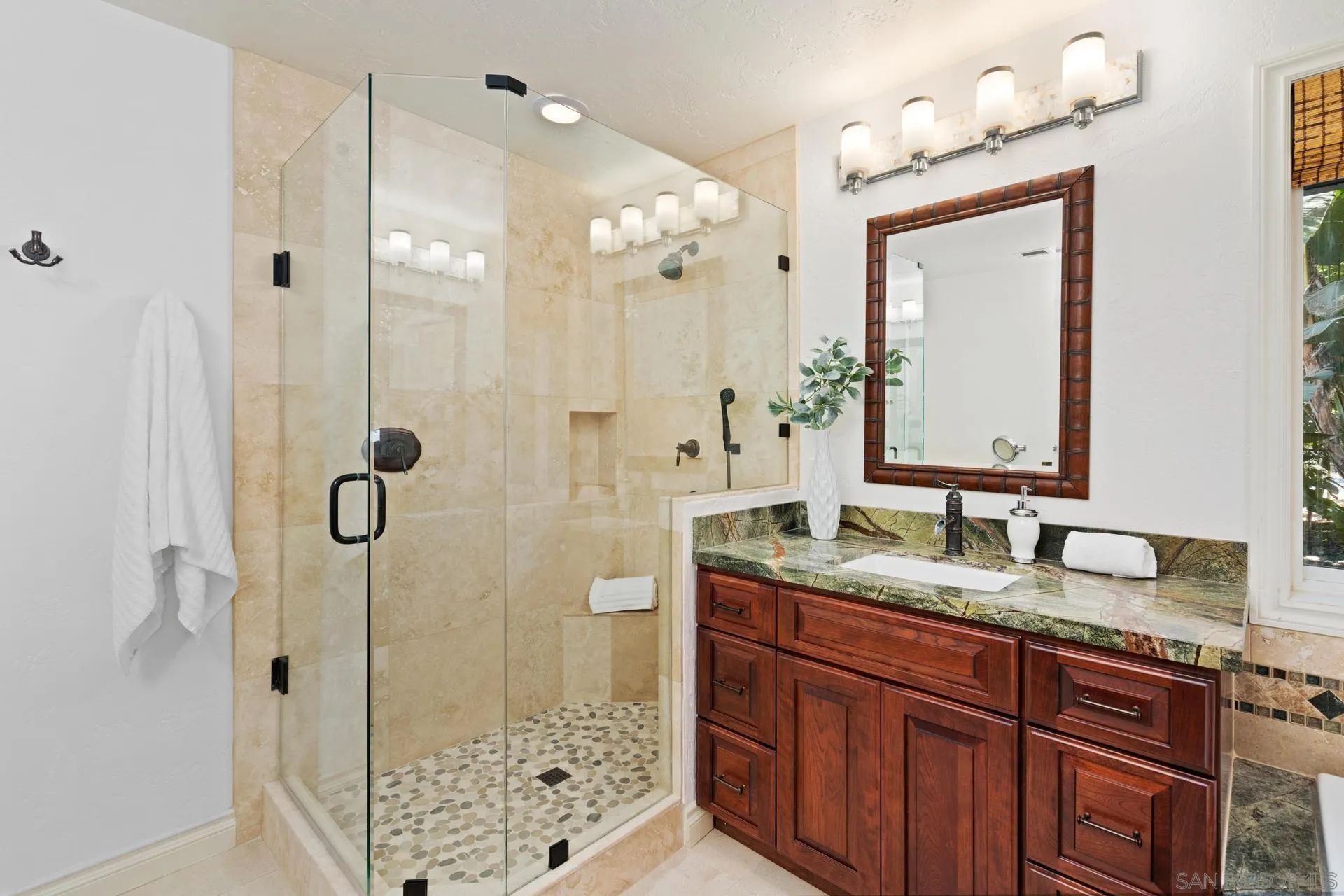 13678 Orchard Gate Road Poway, CA 92064 - Photo 16 of 29 a bathroom with a granite countertop sink mirror and shower