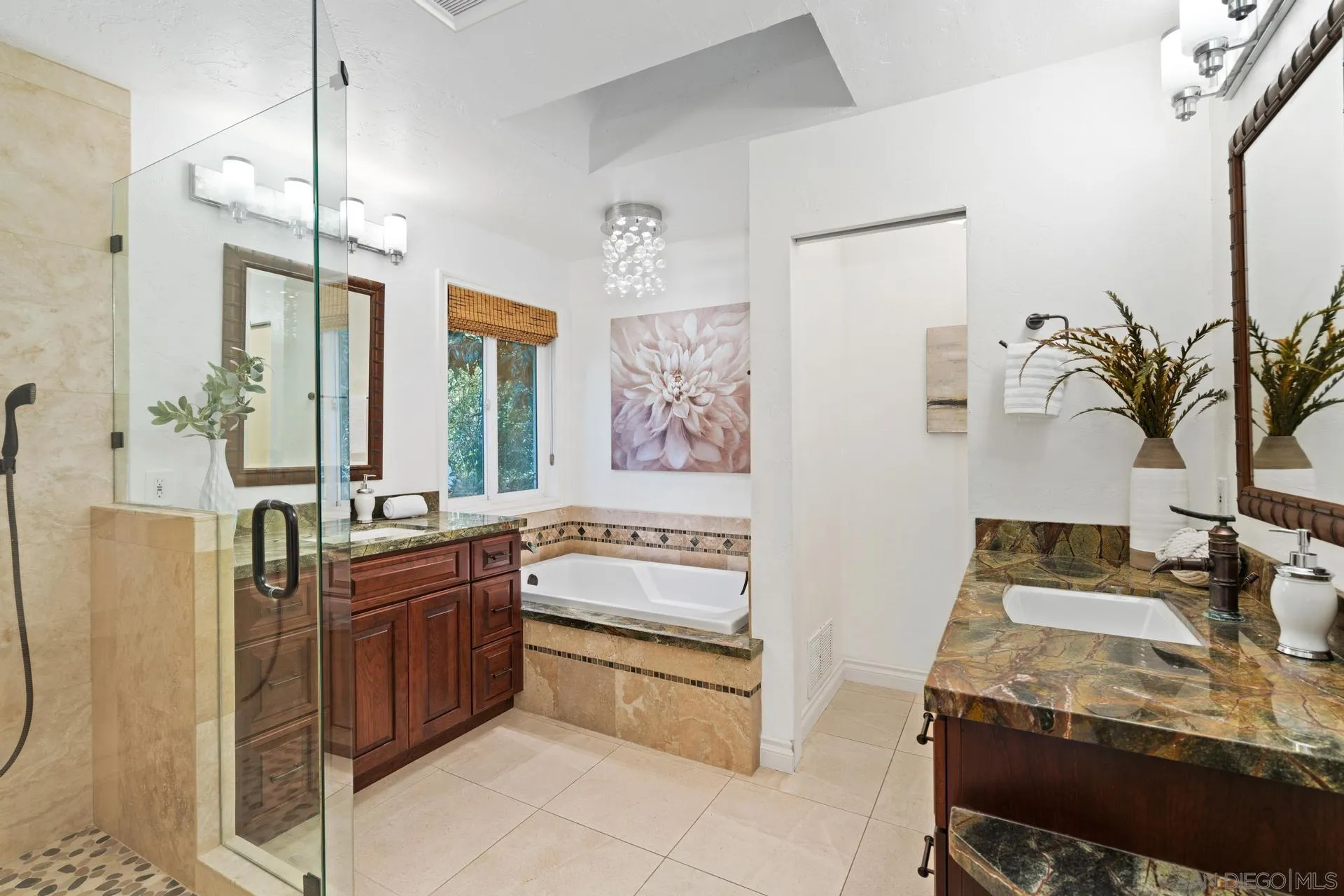 13678 Orchard Gate Road Poway, CA 92064 - Photo 17 of 29 a spacious bathroom with a granite countertop sink a large mirror and a bathtub