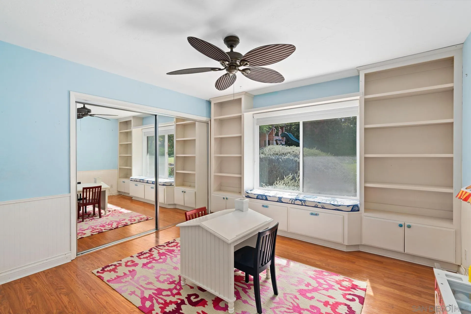 13678 Orchard Gate Road Poway, CA 92064 - Photo 20 of 29 a living room with a large window wooden floor and a table