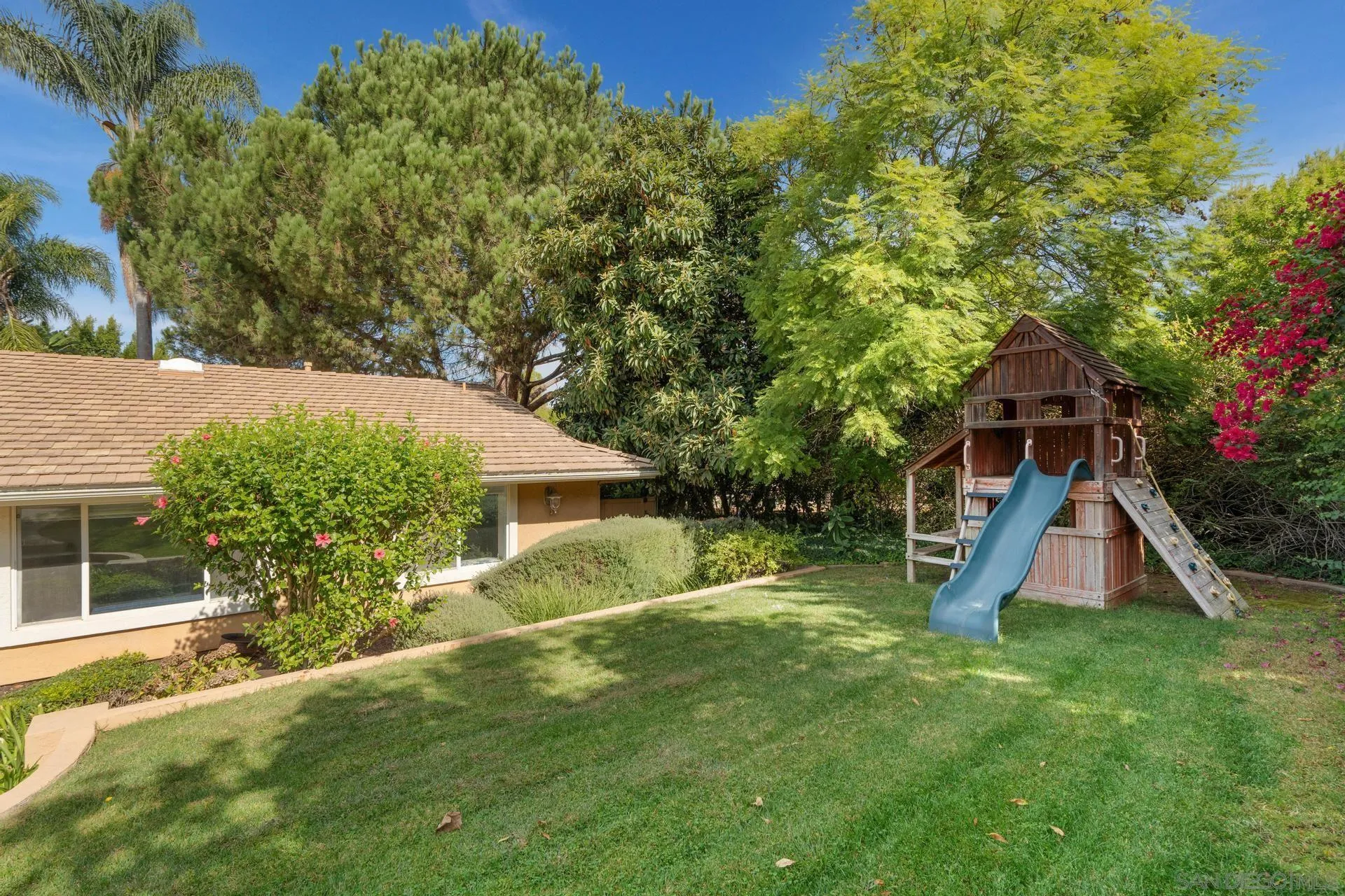 13678 Orchard Gate Road Poway, CA 92064 - Photo 5 of 29 a view of a house with a yard and sitting area