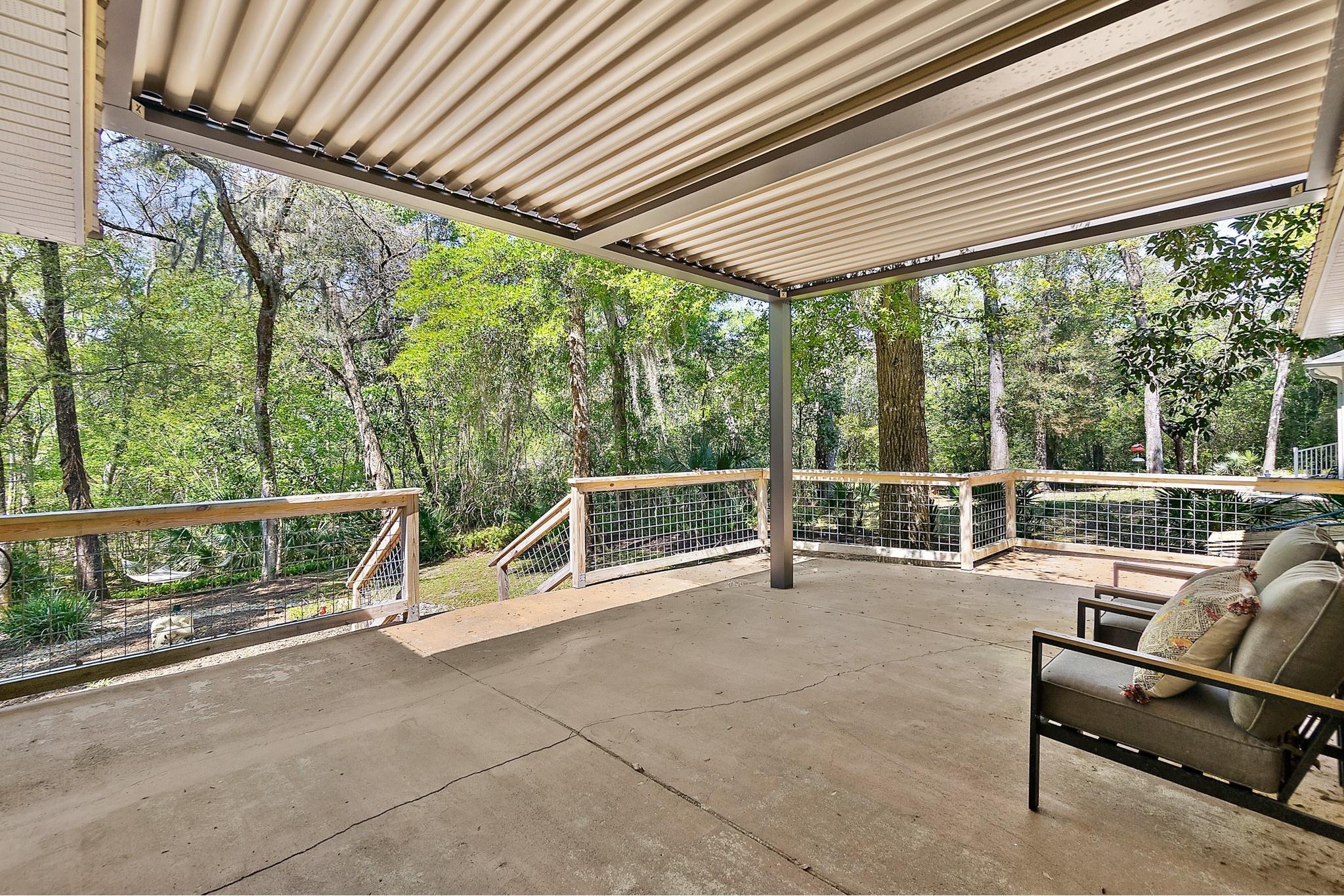 3253 Turtle Creek Road St. Augustine, FL 32086 - Photo 33 of 40 a view of a chairs and table in the balcony
