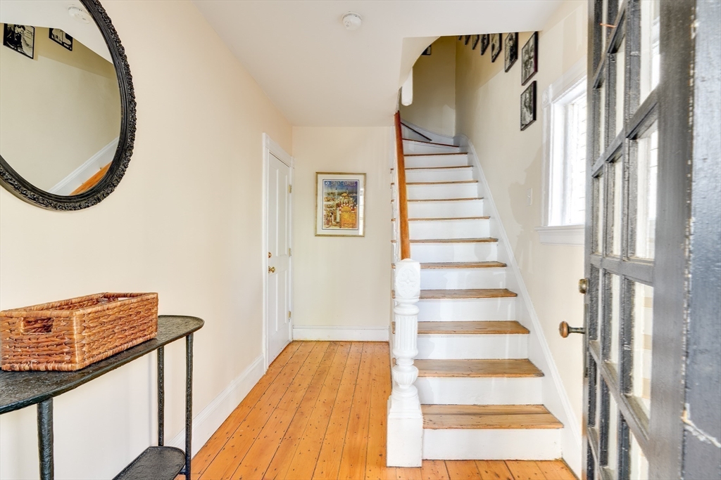 33 Line Street, Unit 1 Cambridge, MA 02138 - Photo 19 of 22 a view of a hallway with wooden floor and entryway