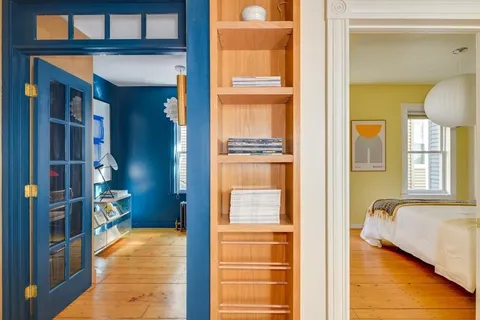 a living room with furniture a dining table and chairs with kitchen view