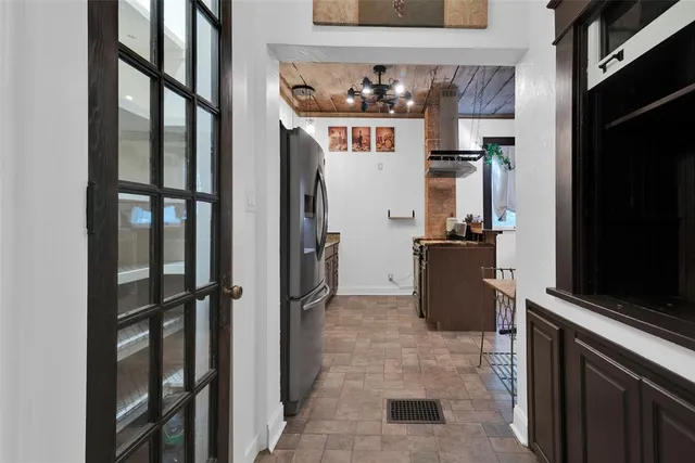 a view of a a dining room with furniture window and wooden floor