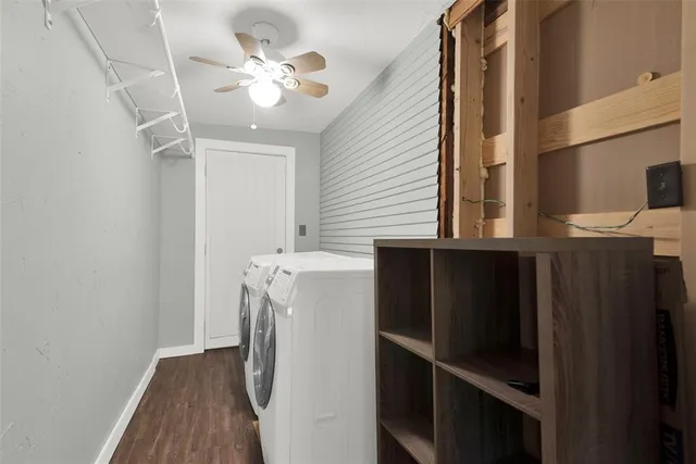a view of a hallway with wooden floor and entryway