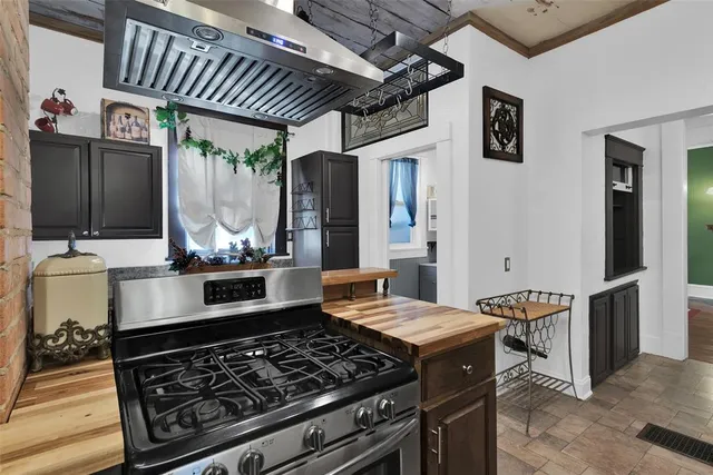 a bathroom with a granite countertop sink a toilet and a shower