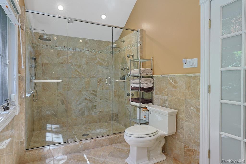 97 Underhill Road Scarsdale, NY 10583 - Photo 20 of 39 a bathroom with a shower and a toilet