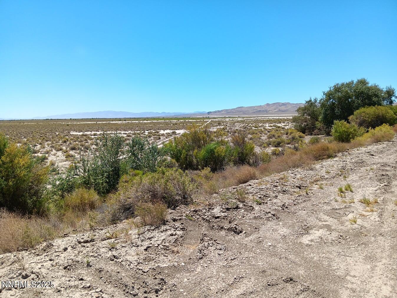 Apn 007-091-75 Apn 007-091-75 Casey Road Fallon, NV 89406 - Photo 3 of 6 a view of a lake with a mountain