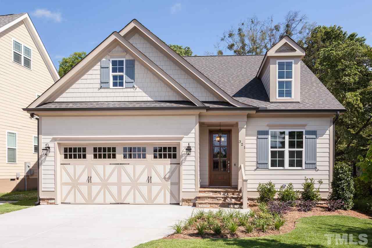 321 Georgetown Road Raleigh, NC 27608 - Photo 1 of 25 a front view of a house with a yard