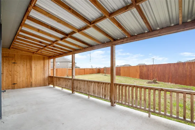 a view of an empty room with a balcony