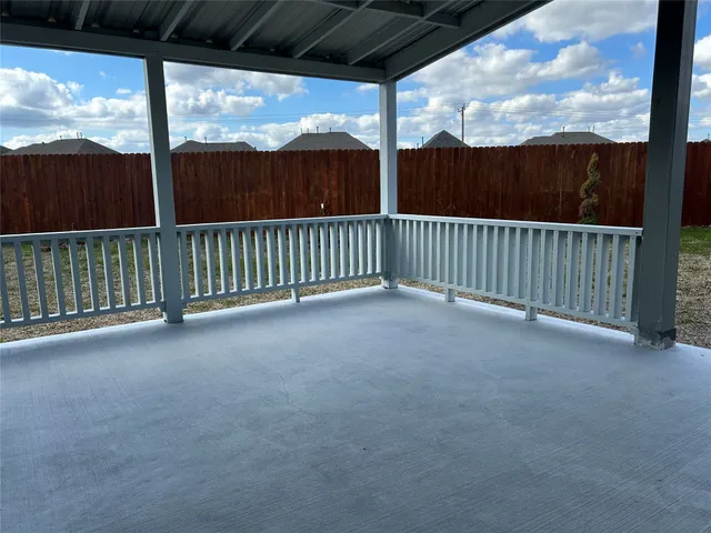a view of balcony with furniture