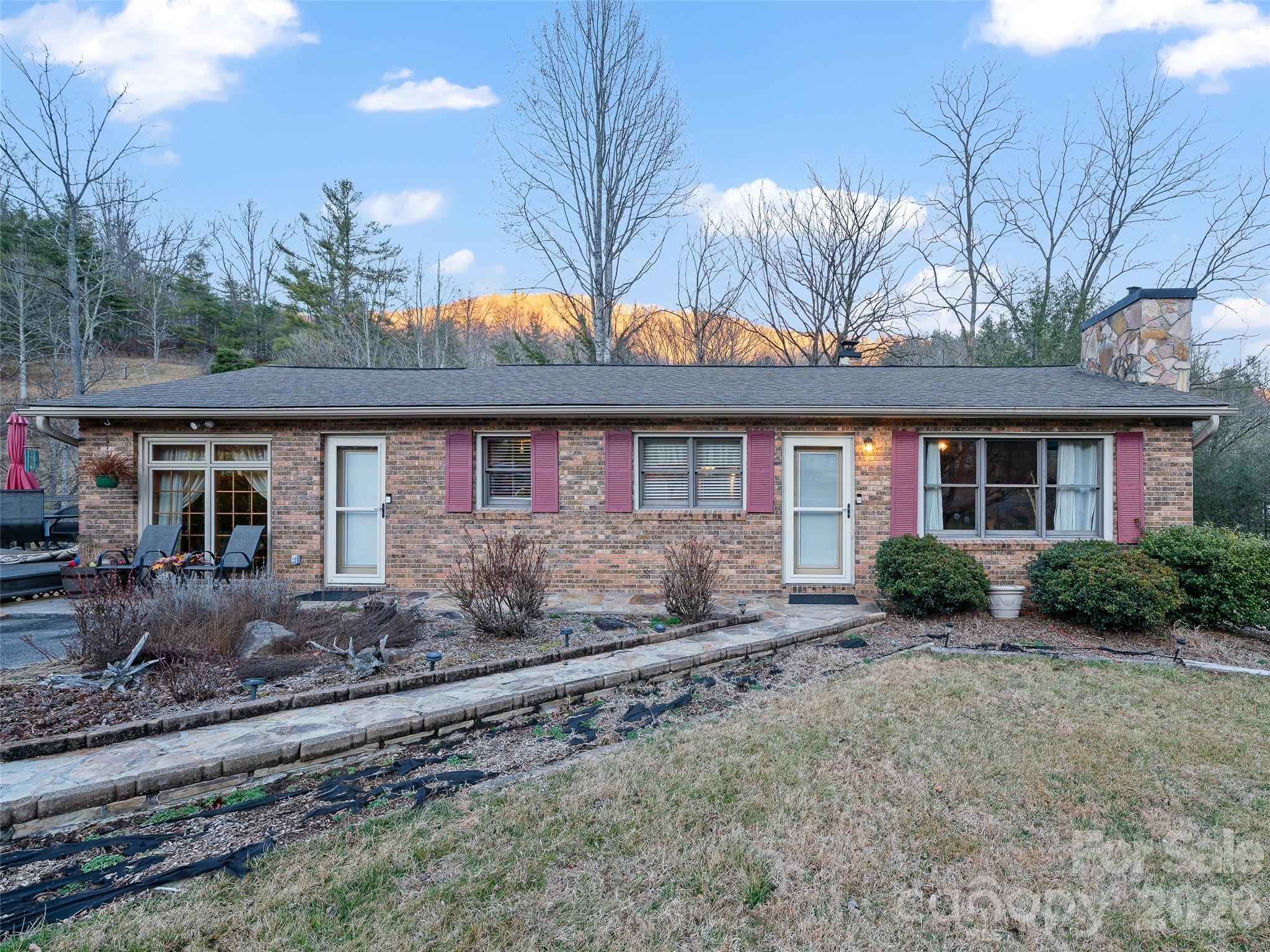 a front view of a house with garden