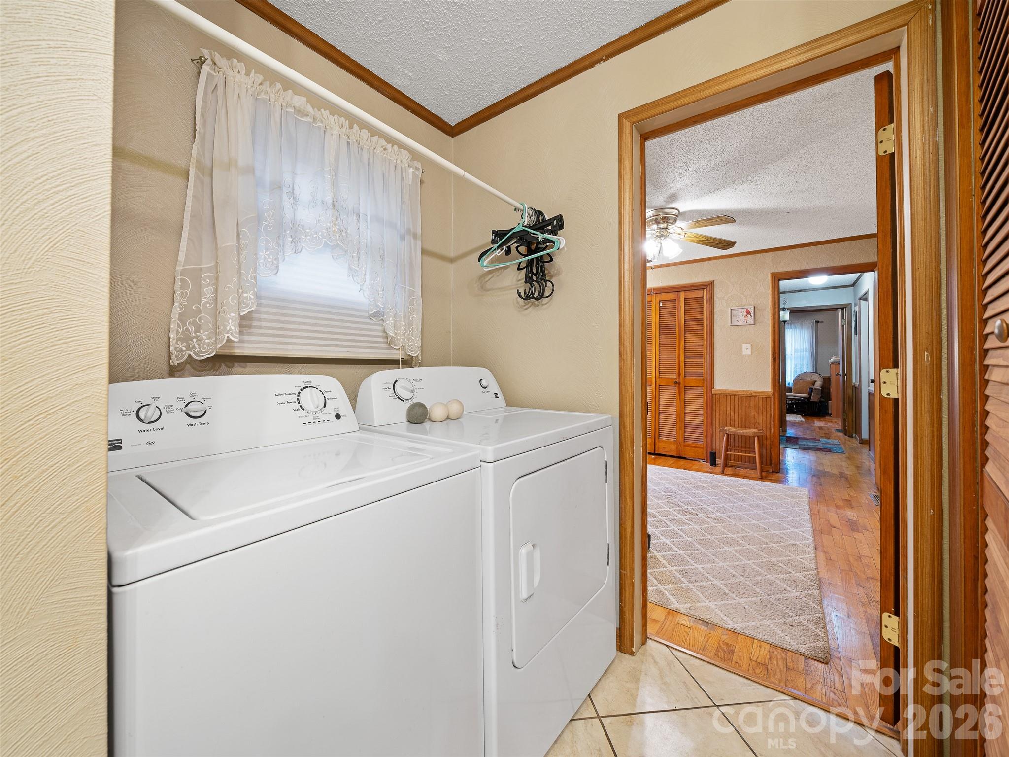1280 Hamburg Road Bakersville, NC 28705 - Photo 16 of 28 a view of washer and dryer with bathroom in the background