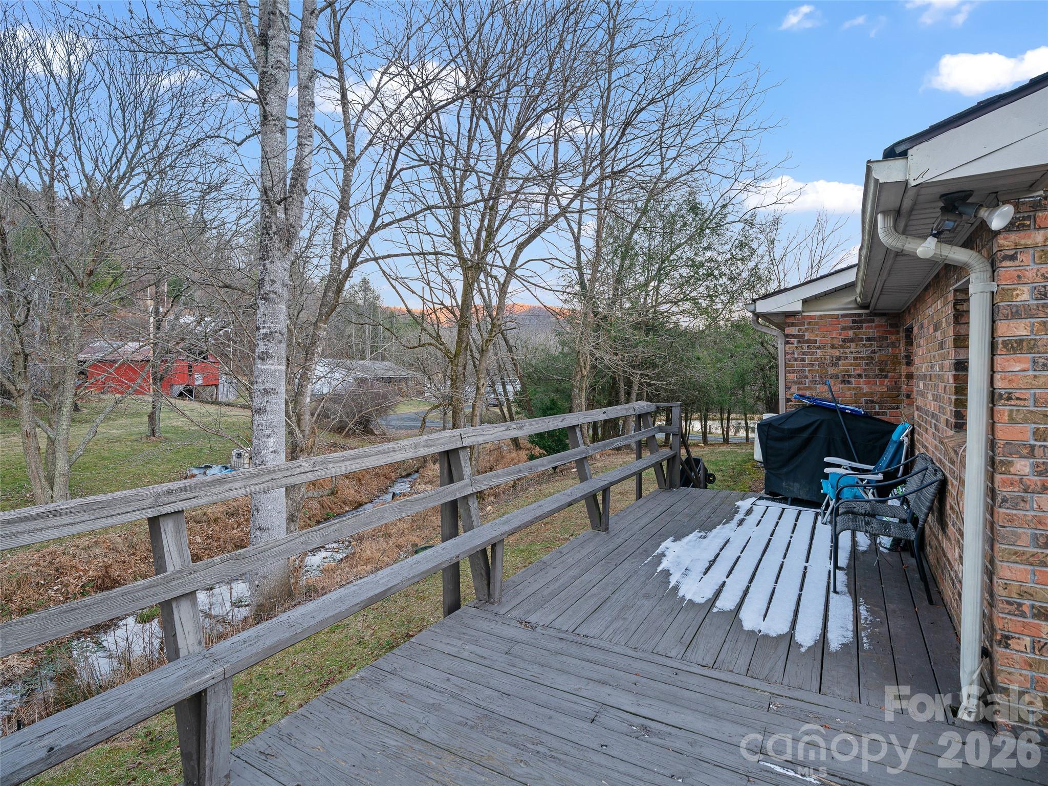 1280 Hamburg Road Bakersville, NC 28705 - Photo 22 of 28 a view of deck with table and chairs a barbeque with wooden floor and fence