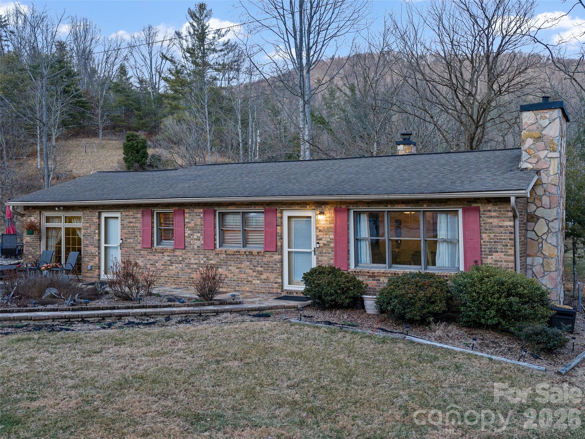 1280 Hamburg Road Bakersville, NC 28705 - Photo 28 of 28 a front view of a house with garden