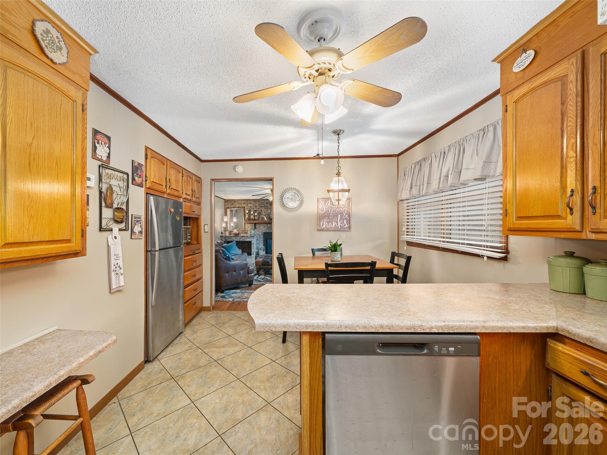 1280 Hamburg Road Bakersville, NC 28705 - Photo 8 of 28 a kitchen with stainless steel appliances granite countertop a sink and a refrigerator
