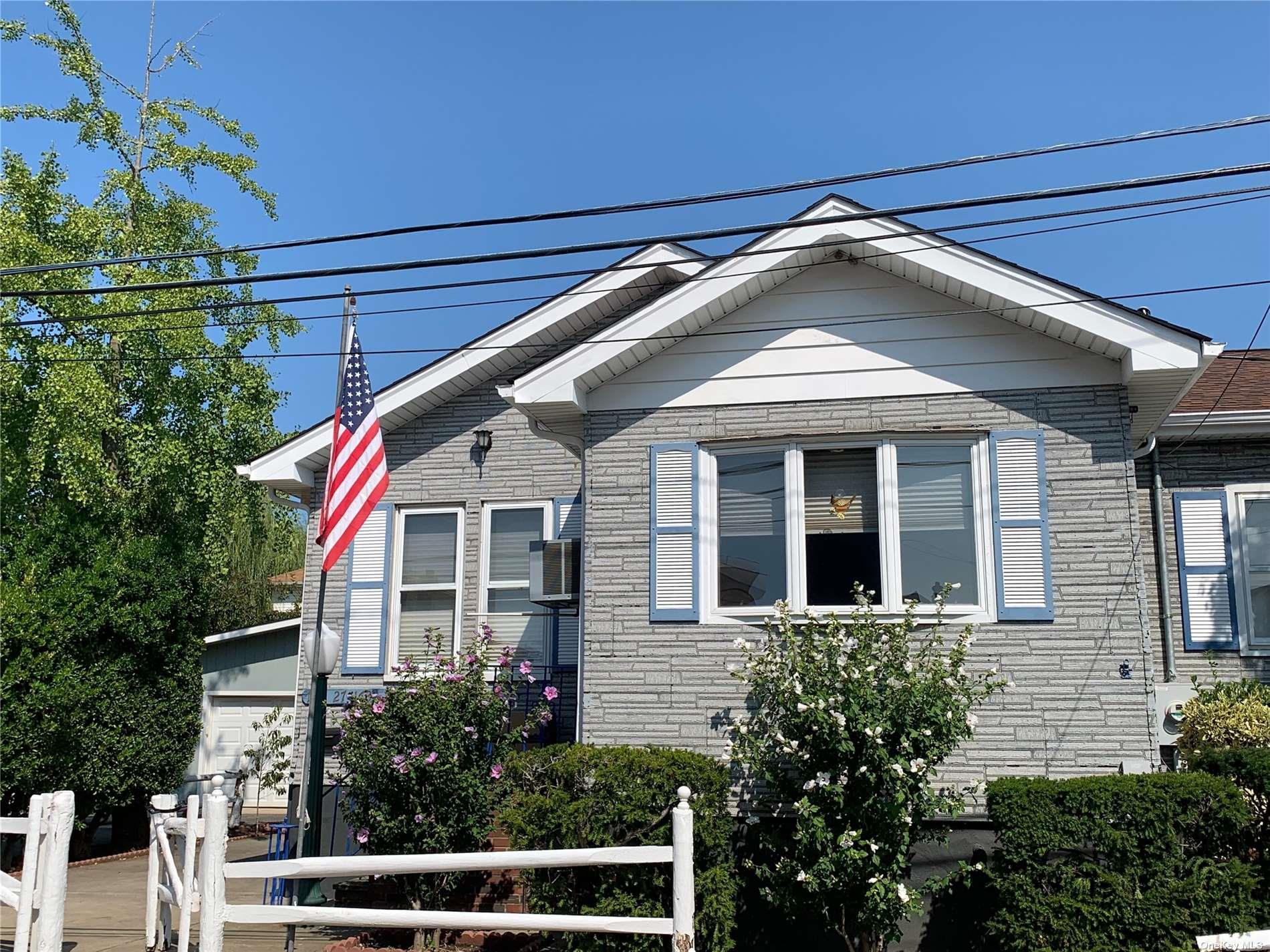 a front view of a house with a porch