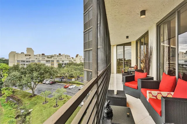 a bathroom with a granite countertop sink a toilet and mirror