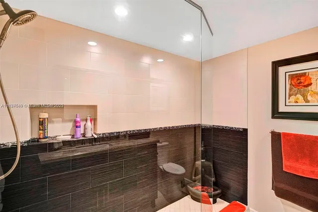 a view of a swimming pool with a yard and palm trees