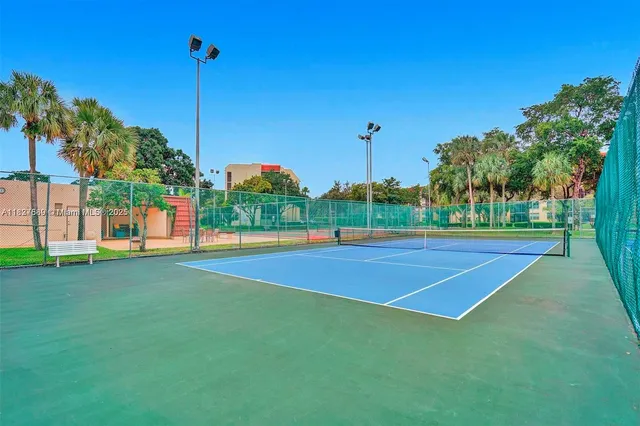 a living room with lots of furniture and table