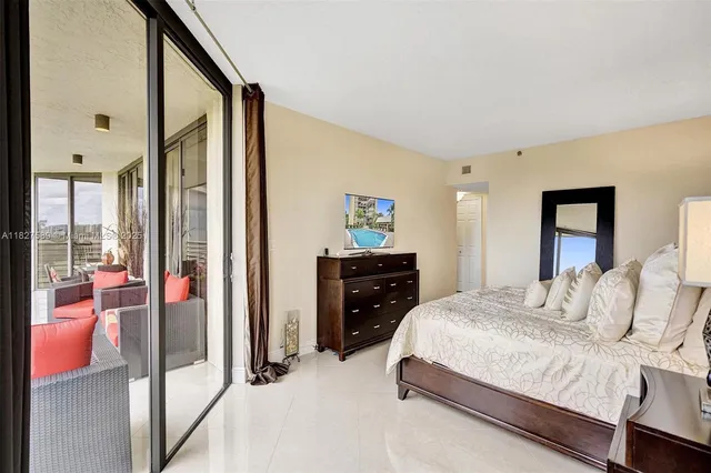 a bedroom with a bed and a table