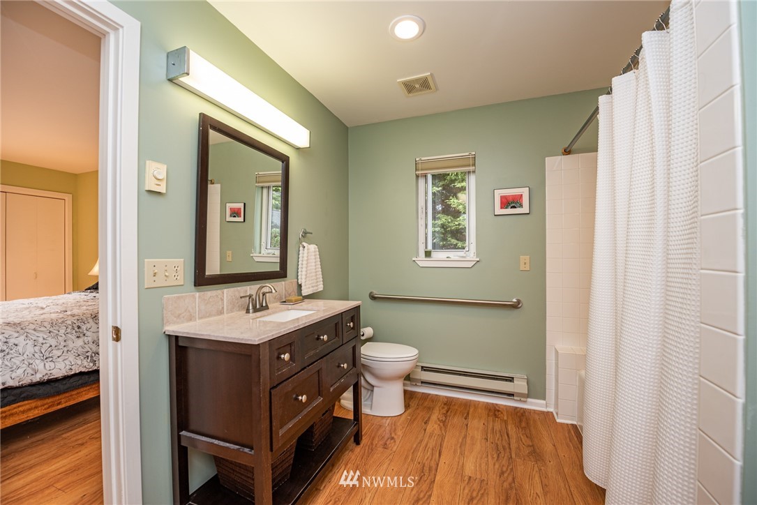 481 Holgerson Road Sequim, WA 98382 - Photo 14 of 40 a bathroom with a sink a toilet a mirror and shower