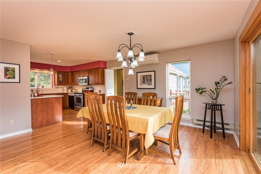 481 Holgerson Road Sequim, WA 98382 - Photo 19 of 40 a view of a dining room with furniture and wooden floor