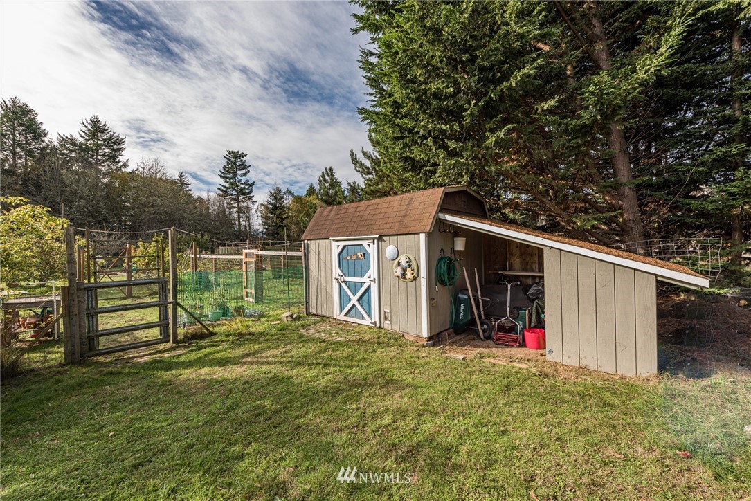 481 Holgerson Road Sequim, WA 98382 - Photo 32 of 40 a view of a house with backyard and garden