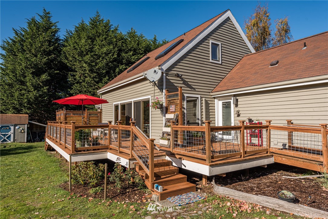 481 Holgerson Road Sequim, WA 98382 - Photo 35 of 40 a view of a house with a yard and sitting area
