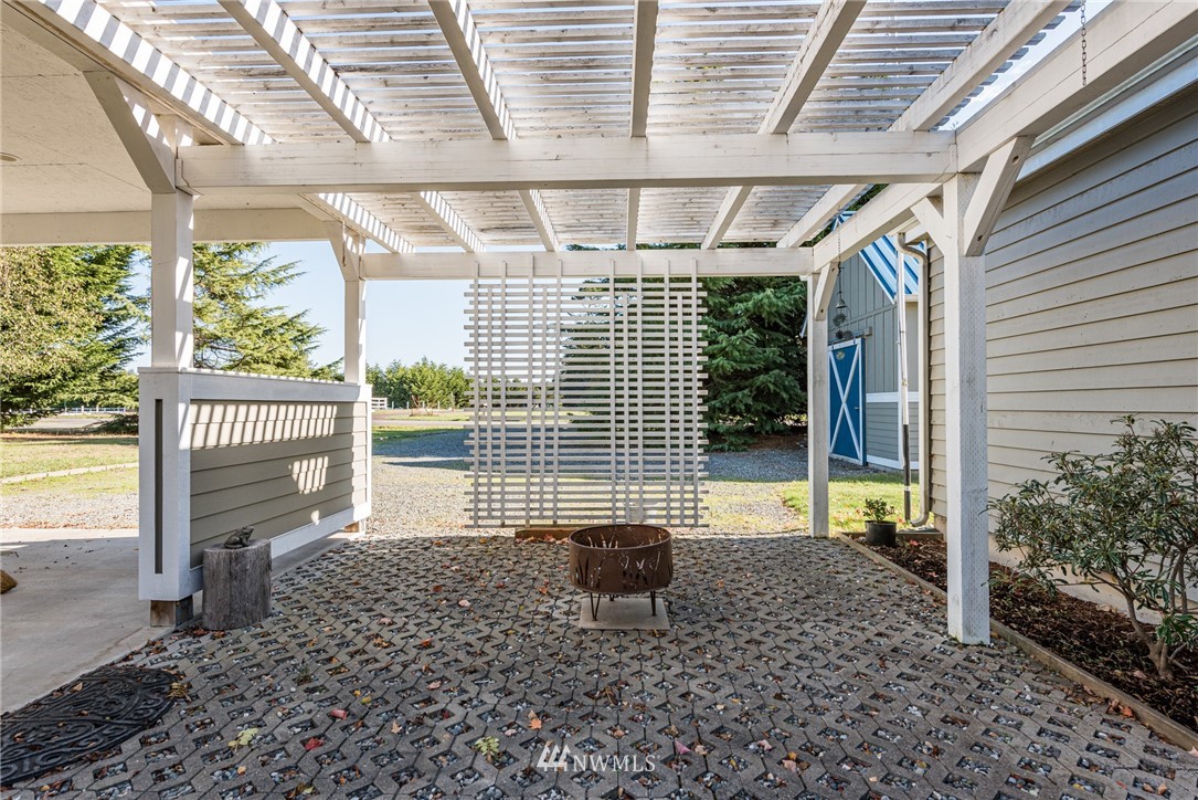 481 Holgerson Road Sequim, WA 98382 - Photo 39 of 40 a living room with a large window and table