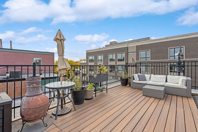 a view of a balcony with wooden floor