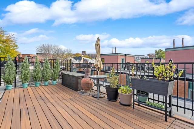 a view of roof deck with patio