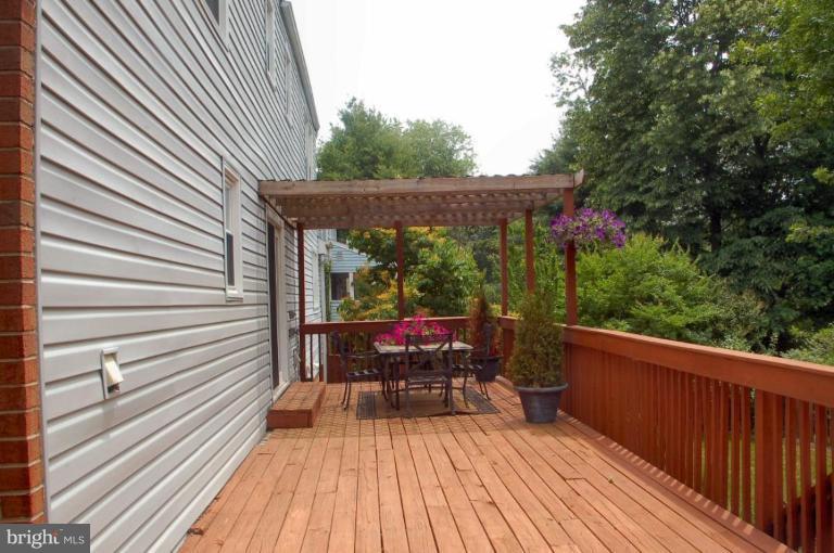 14200 Ansted Road Silver Spring, MD 20905 - Photo 22 of 30 a view of a patio with wooden floor