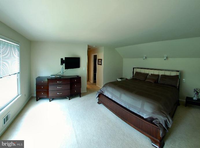 14200 Ansted Road Silver Spring, MD 20905 - Photo 8 of 30 a bedroom with a bed and a tv