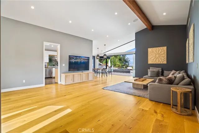 a bedroom with a bed and a large mirror