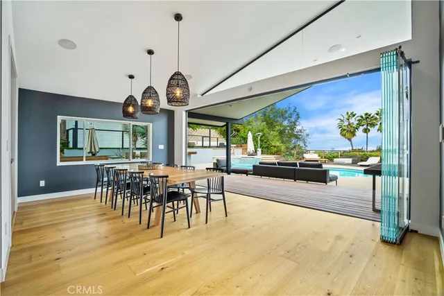 a view of a dining room with furniture window and wooden floor