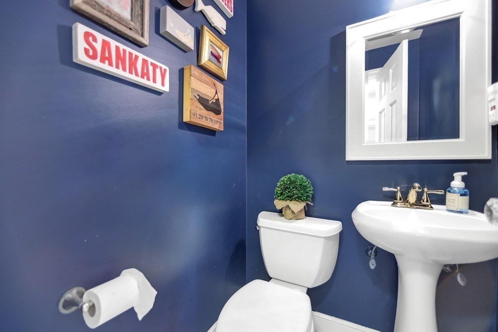 5 Magnolia Road Milton, MA 02186 - Photo 11 of 26 a bathroom with a toilet a sink and a mirror