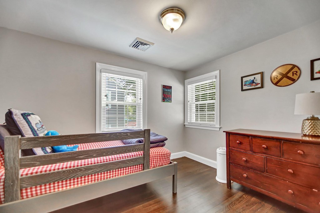 5 Magnolia Road Milton, MA 02186 - Photo 12 of 26 a bedroom with furniture and a window