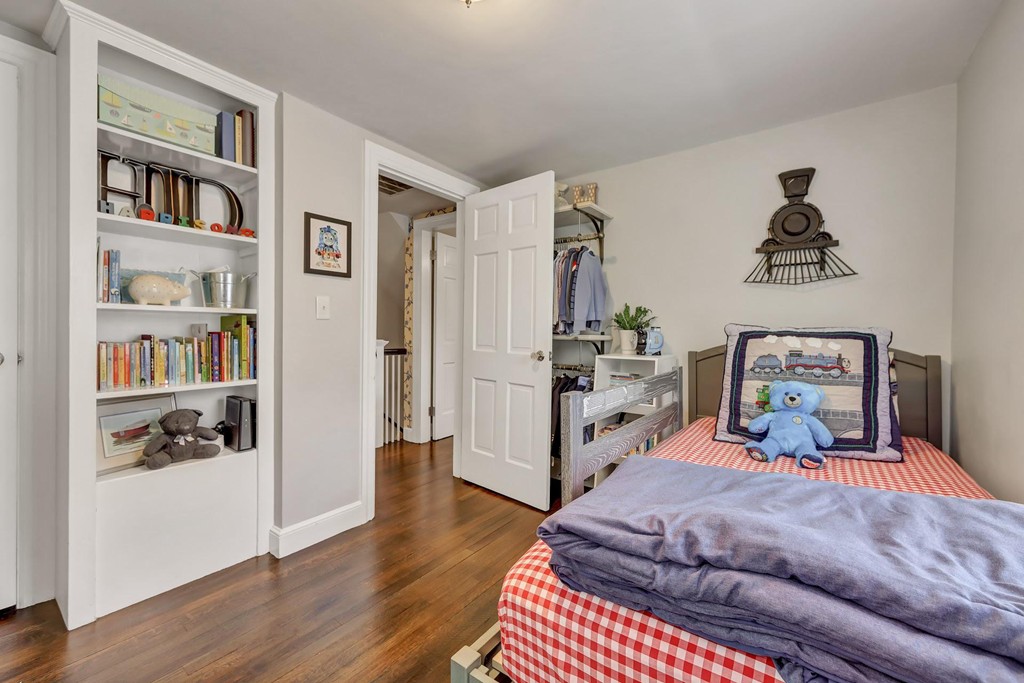 5 Magnolia Road Milton, MA 02186 - Photo 13 of 26 a room with a bed and a book shelf