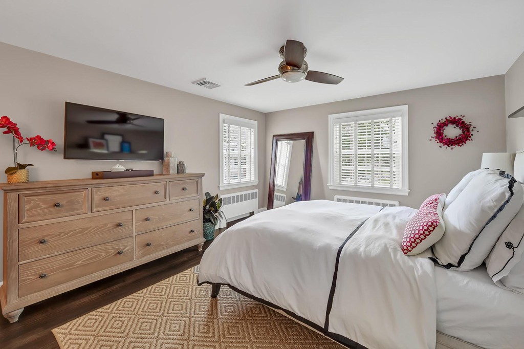 5 Magnolia Road Milton, MA 02186 - Photo 17 of 26 a bedroom with a bed and a flat screen tv