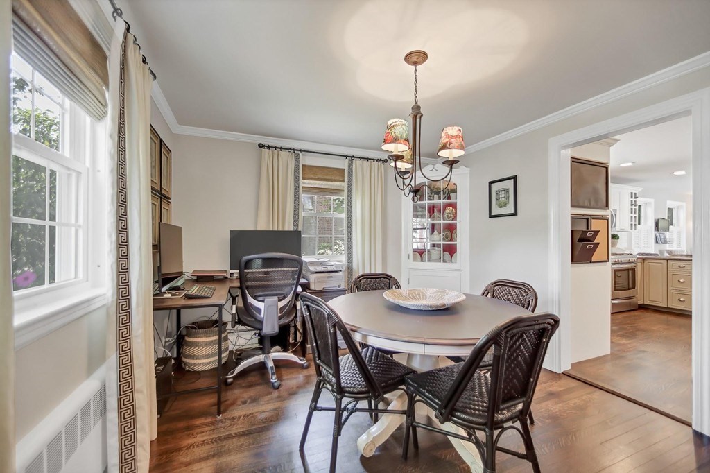 5 Magnolia Road Milton, MA 02186 - Photo 9 of 26 a view of a dining room with furniture wooden floor and chandelier