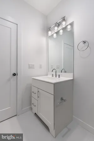 a bathroom with a double vanity sink mirror and vanity