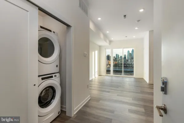 a view of a hallway with washer and dryer