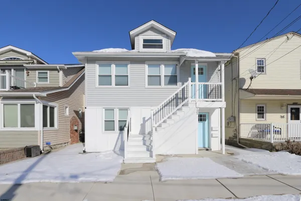 a front view of a house with a porch