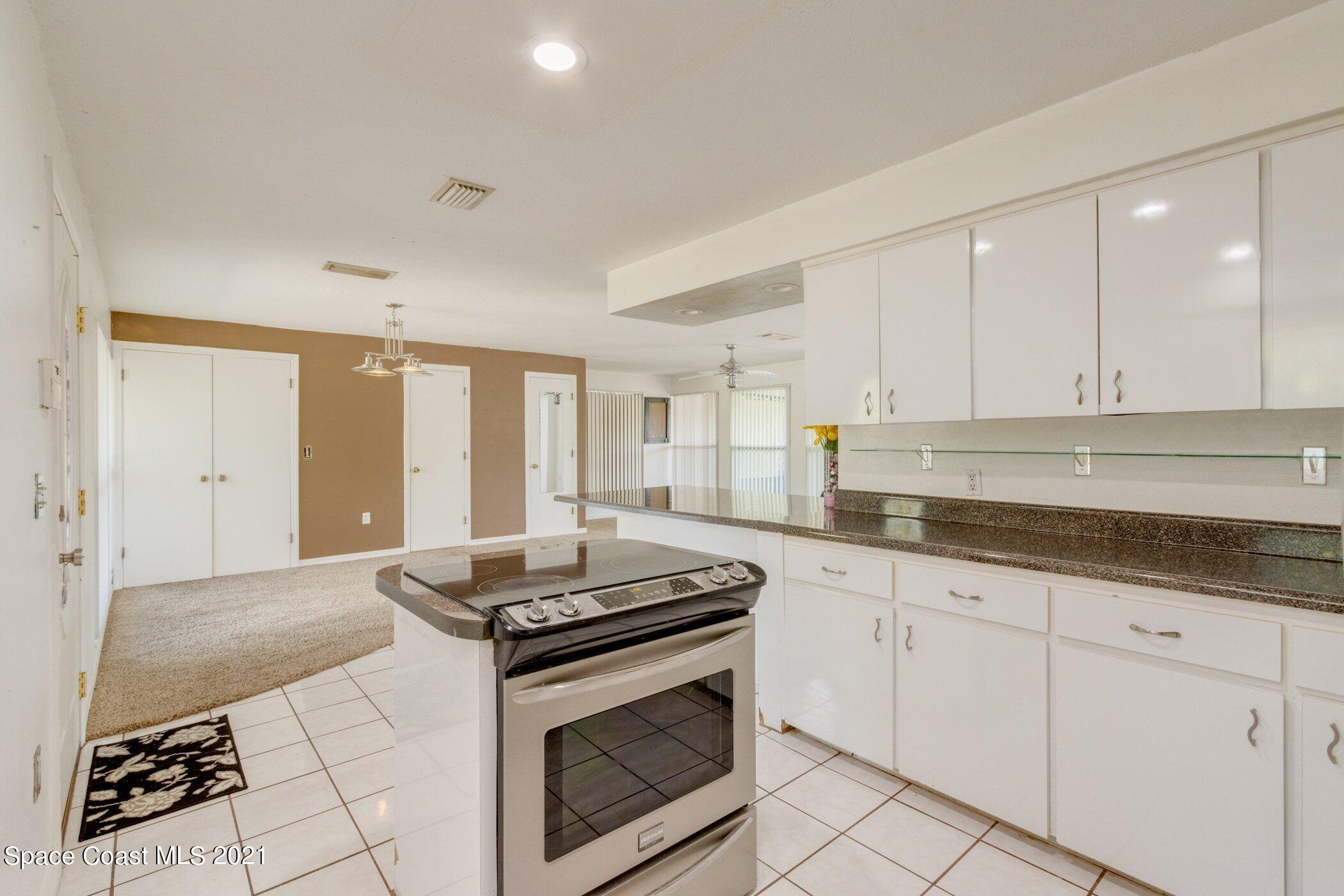 931 Bali Road Cocoa Beach, FL 32931 - Photo 18 of 42 Kitchen to Dinning